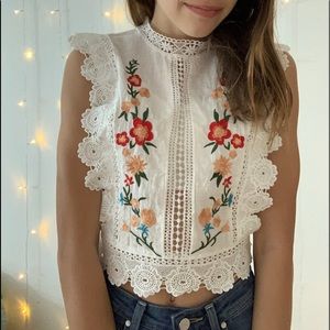Embroidered white sleeveless crop top